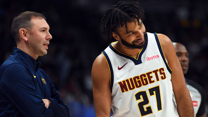 Oct 14, 2025; Denver, Colorado, USA; Denver Nuggets guard Jamal Murray (27) talks with head coach David Adelman during the first half against the Chicago Bulls at Ball Arena. Mandatory Credit: Christopher Hanewinckel-Imagn Images