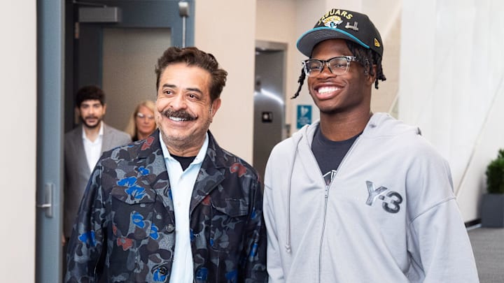 The Jacksonville Jaguars first-round pick, Colorado Buffaloes wide receiver and defensive back Travis Hunter, right, was greeted by Jaguars owner Shahid Khan, left, after Hunter arrived on Friday, April 25, 2025 at Miller Electric Center in Jacksonville, Fla. The team traded up from fifth to second after making a deal with the Cleveland Browns on Thursday night. [Doug Engle/Florida Times-Union]