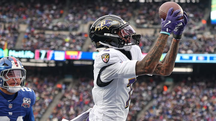 Dec 15, 2024; East Rutherford, New Jersey, USA; Baltimore Ravens wide receiver Rashod Bateman (7) catches a touchdown pass in front of New York Giants safety Dane Belton (24) during the first half at MetLife Stadium. Mandatory Credit: Vincent Carchietta-Imagn Images Dec 15, 2024; East Rutherford, New Jersey, USA; Baltimore Ravens wide receiver Rashod Bateman (7) catches a touchdown pass in front of New York Giants safety Dane Belton (24) during the first half at MetLife Stadium. Mandatory Credit: Vincent Carchietta-Imagn Images
