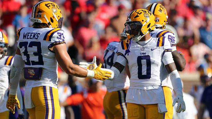 LSU Tigers linebacker West Weeks (33) and safety Tamarcus Cooley (0) react after a defensive stop during the second quarter against the Mississippi Rebels at Vaught-Hemingway Stadium. LSU Tigers linebacker West Weeks (33) and safety Tamarcus Cooley (0) react after a defensive stop during the second quarter against the Mississippi Rebels at Vaught-Hemingway Stadium.