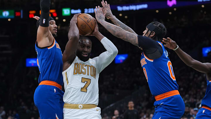 Feb 8, 2026; Boston, Massachusetts, USA; New York Knicks guard Jordan Clarkson (00) and guard Josh Hart (3) defend against Boston Celtics guard Jaylen Brown (7) in the second half at TD Garden.