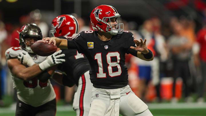 Oct 3, 2024; Atlanta, Georgia, USA; Atlanta Falcons quarterback Kirk Cousins (18) throws against the Tampa Bay Buccaneers in the second quarter at Mercedes-Benz Stadium. Mandatory Credit: Brett Davis-Imagn Images