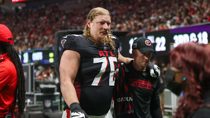 Sep 22, 2024; Atlanta, Georgia, USA; Atlanta Falcons offensive tackle Kaleb McGary (76) leaves the field with an injury against the Kansas City Chiefs in the second quarter at Mercedes-Benz Stadium. Mandatory Credit: Brett Davis-Imagn Images
