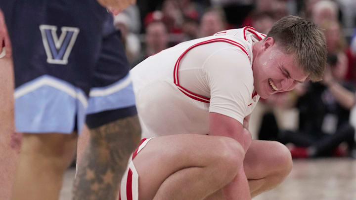 Wisconsin forward Nolan Winter (31) winces after colliding with a Villanova player during the second half of their game Friday, December 19, 2025 at Fiserv Forum in Milwaukee, Wisconsin. Villanova beat Wisconsin 76-66 in overtime. No foul was called.