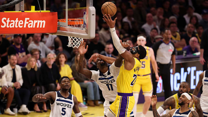 Los Angeles Lakers forward Rui Hachimura shoots the ball over Minnesota Timberwolves center Naz Reid during the fourth quarter of Game 2 of their first-round playoff series at Crypto.com Arena in Los Angeles on April 22, 2025.