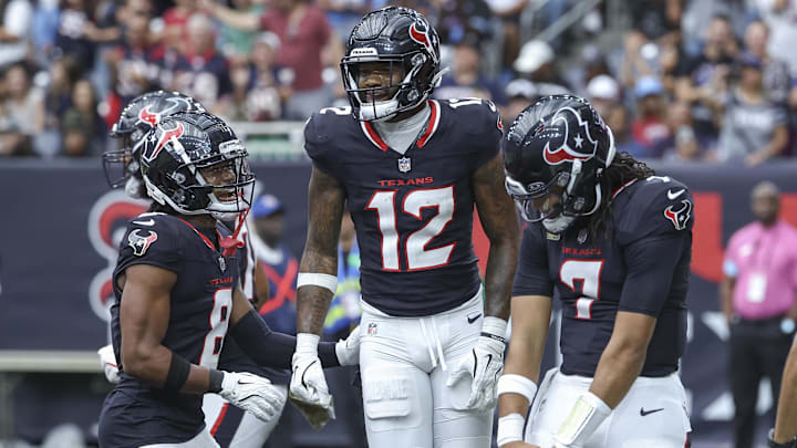 Nov 24, 2024; Houston, Texas, USA; Houston Texans wide receiver Nico Collins (12) celebrates with quarterback C.J. Stroud (7) and wide receiver John Metchie III (8) after a touchdown during the second quarter against the Tennessee Titans at NRG Stadium. Mandatory Credit: Troy Taormina-Imagn Images Nov 24, 2024; Houston, Texas, USA; Houston Texans wide receiver Nico Collins (12) celebrates with quarterback C.J. Stroud (7) and wide receiver John Metchie III (8) after a touchdown during the second quarter against the Tennessee Titans at NRG Stadium. Mandatory Credit: Troy Taormina-Imagn Images