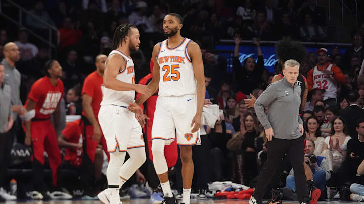 Feb 20, 2025; New York, New York, USA; New York Knicks point guard Jalen Brunson (11) slaps hands with forward Mikal Bridges (25) after he made a play against the Chicago Bulls during the first half at Madison Square Garden. Mandatory Credit: Gregory Fisher-Imagn Images