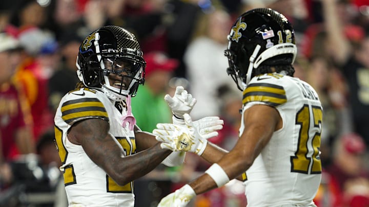 Oct 7, 2024; Kansas City, Missouri, USA; New Orleans Saints wide receiver Rashid Shaheed (22) celebrates with wide receiver Chris Olave (12) after scoring a touchdown during the first half against the Kansas City Chiefs at GEHA Field at Arrowhead Stadium. Mandatory Credit: Jay Biggerstaff-Imagn Images