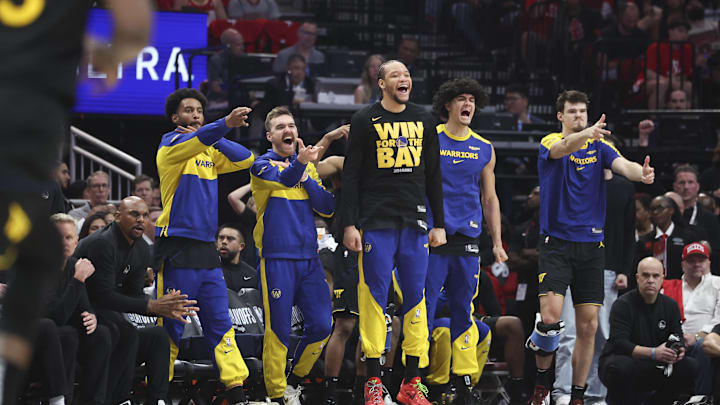 May 4, 2025; Houston, Texas, USA; Golden State Warriors bench players celebrate after a basket by guard Buddy Hield (not pictured) during the second quarter of game seven of the first round for the 2025 NBA Playoffs against the Houston Rockets  at Toyota Center. Mandatory Credit: Troy Taormina-Imagn Images