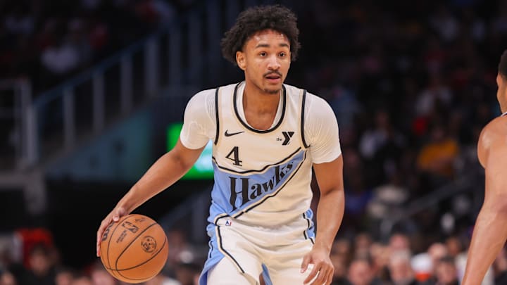 Nov 25, 2024; Atlanta, Georgia, USA; Atlanta Hawks guard Kobe Bufkin (4) dribbles against the Dallas Mavericks in the fourth quarter at State Farm Arena. Mandatory Credit: Brett Davis-Imagn Images
