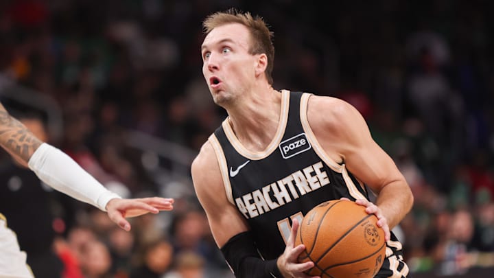 Jan 17, 2026; Atlanta, Georgia, USA; Atlanta Hawks guard Luke Kennard (4) shoots against the Boston Celtics in the first quarter at State Farm Arena. Mandatory Credit: Brett Davis-Imagn Images
