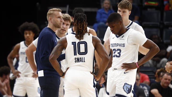 Oct 11, 2025; Memphis, Tennessee, USA; Memphis Grizzlies head coach Tuomas Iisalo huddles with guard Cam Spencer (24), guard Javon Small (10), forward Cedric Coward (23) and center Lawson Lovering (34) during a timeout during the second quarter against the Atlanta Hawks at FedExForum. Mandatory Credit: Petre Thomas-Imagn Images