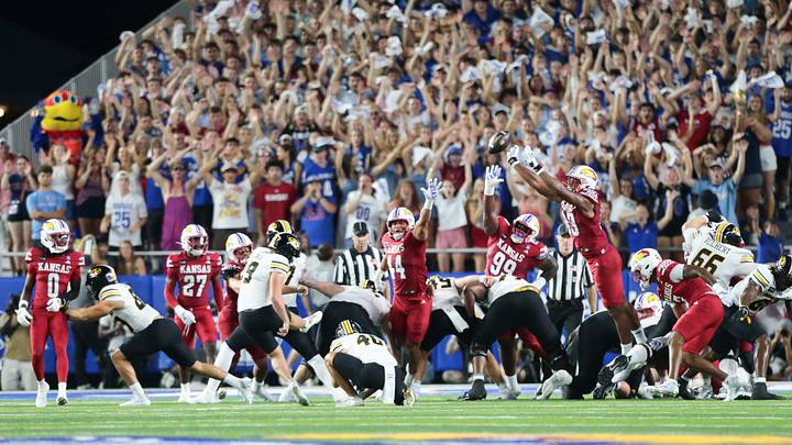 Kansas Jayhawks defensive end Leroy Harris III (33) blocks a kick by Missouri Tigers kicker Blake Craig (19)  during the game inside David Booth Kansas Memorial Stadium on Sept. 11, 2026.