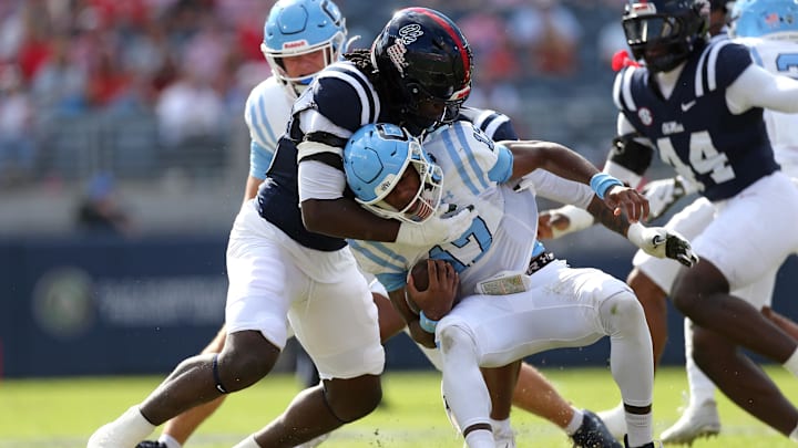 `Nov 8, 2025; Oxford, Mississippi, USA; Mississippi Rebels linebacker Princewill Umanmielen (1) tackles The Citadel Bulldogs quarterback Quentin Hayes (17) during the second quarter at Vaught-Hemingway Stadium. Mandatory Credit: Petre Thomas-Imagn Images