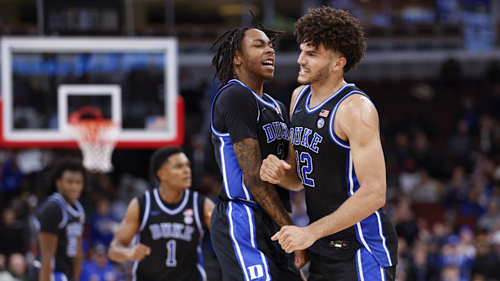 Nov 27, 2025; Chicago, Illinois, USA; Duke Blue Devils forward Cameron Boozer (12) celebrates with guard Isaiah Evans (3) during the second half at United Center. Mandatory Credit: Kamil Krzaczynski-Imagn Images Nov 27, 2025; Chicago, Illinois, USA; Duke Blue Devils forward Cameron Boozer (12) celebrates with guard Isaiah Evans (3) during the second half at United Center. Mandatory Credit: Kamil Krzaczynski-Imagn Images