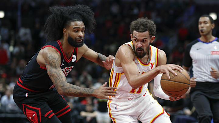 Nov 22, 2024; Chicago, Illinois, USA; Atlanta Hawks guard Trae Young (11) drives to the basket against Chicago Bulls guard Coby White (0) during the second half at United Center. Mandatory Credit: Kamil Krzaczynski-Imagn Images Nov 22, 2024; Chicago, Illinois, USA; Atlanta Hawks guard Trae Young (11) drives to the basket against Chicago Bulls guard Coby White (0) during the second half at United Center. Mandatory Credit: Kamil Krzaczynski-Imagn Images
