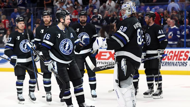 Apr 15, 2025; Tampa, Florida, USA;Tampa Bay Lightning goaltender Andrei Vasilevskiy (88) and Tampa Bay Lightning right wing Nikita Kucherov (86) celebrate after they beat the Florida Panthers at Amalie Arena. Mandatory Credit: Kim Klement Neitzel-Imagn Images