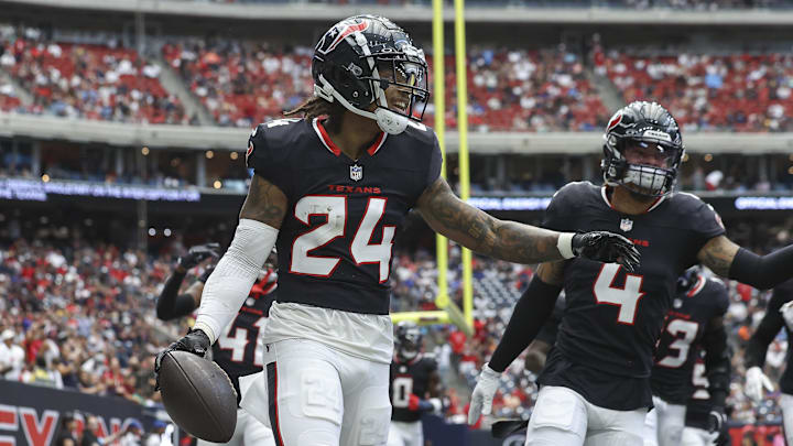 Aug 17, 2024; Houston, Texas, USA; Houston Texans cornerback Derek Stingley Jr. (24) celebrates after an interception during the first quarter against the New York Giants at NRG Stadium. Mandatory Credit: Troy Taormina-Imagn Images