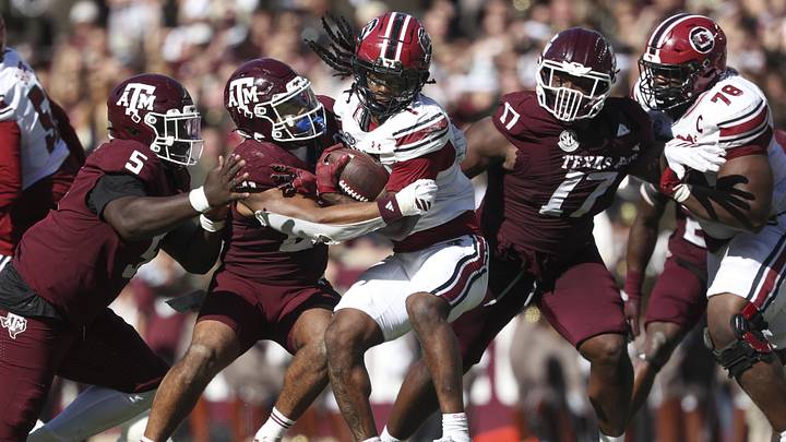 Texas A&M Aggies linebacker Taurean York (21) tackles South Carolina Gamecocks running back Rahsul Faison (1) during the third quarter at Kyle Field. Texas A&M Aggies linebacker Taurean York (21) tackles South Carolina Gamecocks running back Rahsul Faison (1) during the third quarter at Kyle Field.