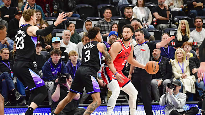Feb 13, 2025; Salt Lake City, Utah, USA; Utah Jazz guard Keyonte George (3) defends LA Clippers guard/forward Ben Simmons (25) during the first half at the Delta Center. Mandatory Credit: Christopher Creveling-Imagn Images