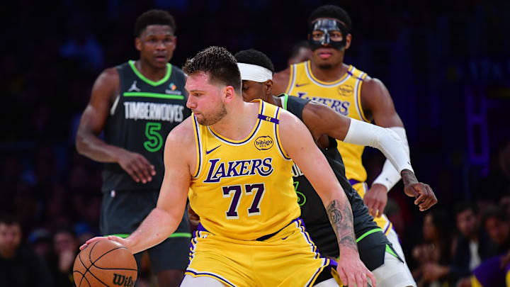 Apr 30, 2025; Los Angeles, California, USA; Los Angeles Lakers guard Luka Doncic (77) controls the ball against the Minnesota Timberwolves during the second half in game five of first round for the 2025 NBA Playoffs at Crypto.com Arena. Mandatory Credit: Gary A. Vasquez-Imagn Images