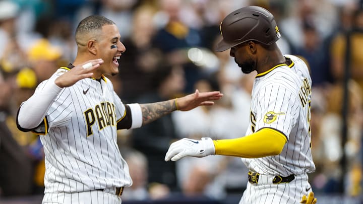 Apr 12, 2025; San Diego, California, USA; San Diego Padres left fielder Jason Heyward (22) celebrates with San Diego Padres third baseman Manny Machado (13) after hitting a one-run home run during the fifth inning against the Colorado Rockies at Petco Park. Mandatory Credit: David Frerker-Imagn Images