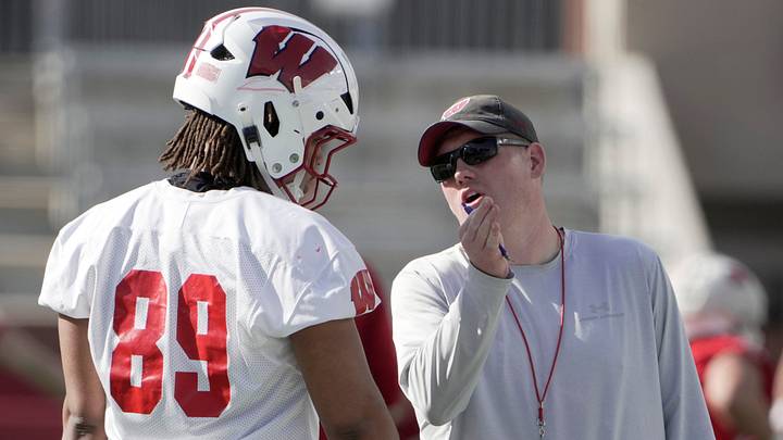 Wisconsin assistant head coach/tight ends Nate Letton talks with tight end Jacob Harris. Wisconsin assistant head coach/tight ends Nate Letton talks with tight end Jacob Harris.