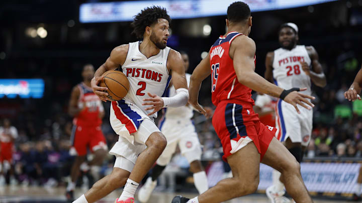 Nov 17, 2024; Washington, District of Columbia, USA; Detroit Pistons guard Cade Cunningham (2) drives to the basket as Washington Wizards guard Malcolm Brogdon (15) defend in the first half at Capital One Arena. Mandatory Credit: Geoff Burke-Imagn Images