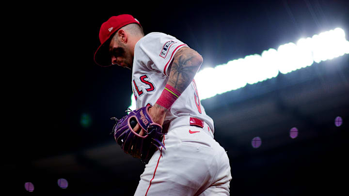 Sep 9, 2025; Anaheim, California, USA; Los Angeles Angels shortstop Zach Neto (9) heads out for the ninth inning against the Minnesota Twins at Angel Stadium. Mandatory Credit: Gary A. Vasquez-Imagn Images