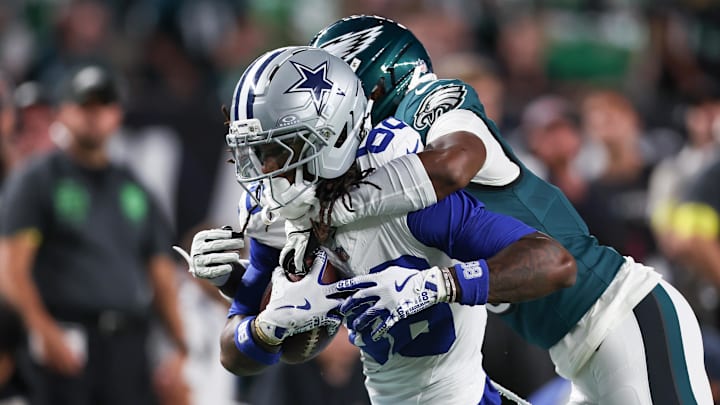 Sep 4, 2025; Philadelphia, Pennsylvania, USA; Philadelphia Eagles cornerback Adoree' Jackson (8) tackles Dallas Cowboys wide receiver CeeDee Lamb (88) during the first quarter of the game at Lincoln Financial Field. Mandatory Credit: Bill Streicher-Imagn Images