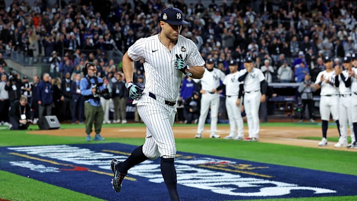 Oct 28, 2024; New York, New York, USA; New York Yankees designated hitter Giancarlo Stanton (27) is introduced before playing against the Los Angeles Dodgers in game three of the 2024 MLB World Series at Yankee Stadium.
