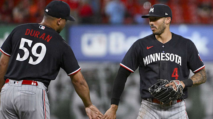 Aug 1, 2023; St. Louis, Missouri, USA; Minnesota Twins shortstop Carlos Correa (4) celebrates with relief pitcher Jhoan Duran (59) after the Twins defeated the St. Louis Cardinals at Busch Stadium.