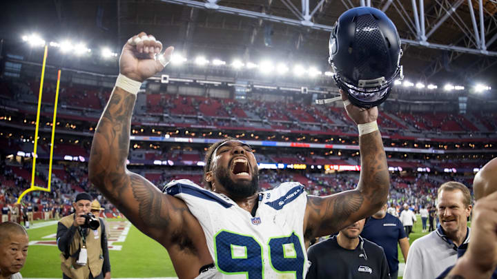 Dec 8, 2024; Glendale, Arizona, USA; Seattle Seahawks defensive end Leonard Williams (99) celebrates after defeating the Arizona Cardinals at State Farm Stadium. 