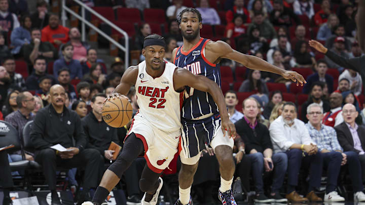 Dec 15, 2022; Houston, Texas, USA; Miami Heat forward Jimmy Butler (22) drives with the ball as Houston Rockets forward Tari Eason (17) defends during the third quarter at Toyota Center. Mandatory Credit: Troy Taormina-Imagn Images Dec 15, 2022; Houston, Texas, USA; Miami Heat forward Jimmy Butler (22) drives with the ball as Houston Rockets forward Tari Eason (17) defends during the third quarter at Toyota Center. Mandatory Credit: Troy Taormina-Imagn Images