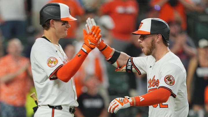 Jun 24, 2025; Baltimore, Maryland, USA; Baltimore Orioles designated hitter Ryan O’Hearn (32) is greeted by first baseman Coby Mayo (16) following his solo home run during the seventh inning against the Texas Rangers at Oriole Park at Camden Yards. 
