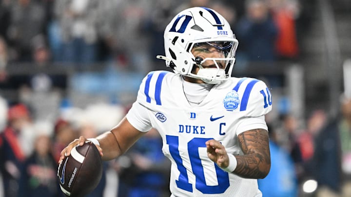 Dec 6, 2025; Charlotte, NC, USA; Duke Blue Devils quarterback Darian Mensah (10) looks to throw in the second quarter against the Virginia Cavaliers during the 2025 ACC Championship game at Bank of America Stadium. Mandatory Credit: Bob Donnan-Imagn Images