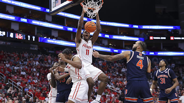Nov 9, 2024; Houston, Texas, USA; Houston Cougars forward Joseph Tugler (11) dunks the ball during the second half against the Auburn Tigers at Toyota Center. Mandatory Credit: Troy Taormina-Imagn Images
