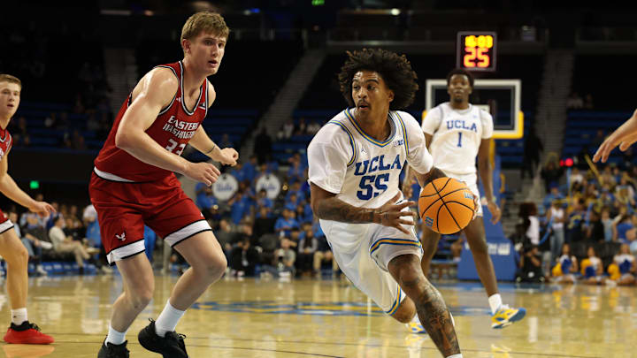 Nov 3, 2025; Los Angeles, California, USA;  UCLA Bruins guard Skyy Clark (55) drives to the basket against Eastern Washington Eagles forward Emmett Marquardt (33) during the second half at Pauley Pavilion presented by Wescom Financial. Mandatory Credit: Kiyoshi Mio-Imagn Images