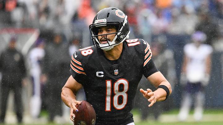 Chicago Bears quarterback Caleb Williams (18) scrambles
