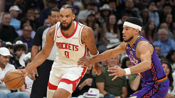 Mar 30, 2025; Phoenix, Arizona, USA; Houston Rockets forward Dillon Brooks (9) drives past Phoenix Suns guard Devin Booker (1) in the first half at Footprint Center. Mandatory Credit: Rick Scuteri-Imagn Images Mar 30, 2025; Phoenix, Arizona, USA; Houston Rockets forward Dillon Brooks (9) drives past Phoenix Suns guard Devin Booker (1) in the first half at Footprint Center. Mandatory Credit: Rick Scuteri-Imagn Images