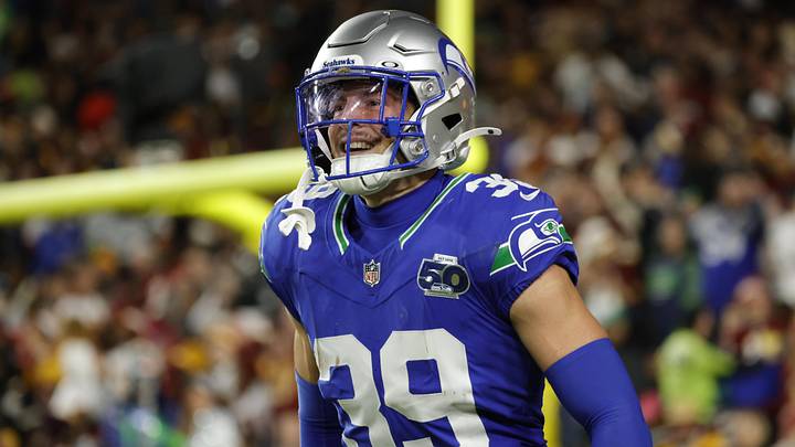 Nov 2, 2025; Landover, Maryland, USA; Seattle Seahawks safety Ty Okada (39) celebrates a pass interception during the first half against the Washington Commanders during the first half at Northwest Stadium. Mandatory Credit: Amber Searls-Imagn Images