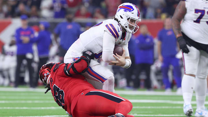 Nov 20, 2025; Houston, Texas, USA; Houston Texans defensive tackle Tim Settle Jr. (98) sacks Buffalo Bills quarterback Josh Allen (17)