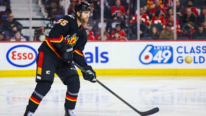 Jan 27, 2024; Calgary, Alberta, CAN; Calgary Flames defenseman Noah Hanifin (55) controls the puck