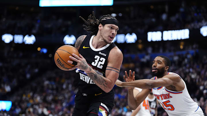 Mar 6, 2026; Denver, Colorado, USA; Denver Nuggets forward Aaron Gordon (32) and New York Knicks guard Mikal Bridges (25) during the second quarter at Ball Arena. Mandatory Credit: Ron Chenoy-Imagn Images