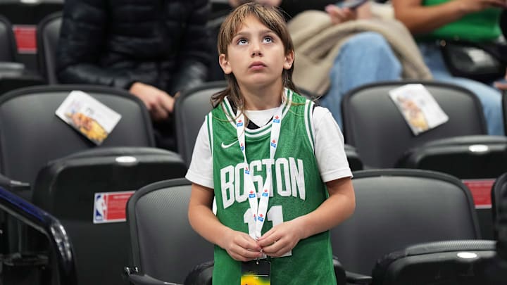 A fan looks up at the video board during the pregame warmup before a game between the Boston Celtics and the Toronto Raptors at the Scotiabank Arena.