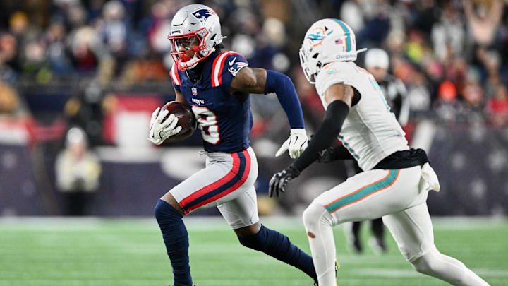 Jan 4, 2026; Foxborough, Massachusetts, USA; New England Patriots wide receiver Stefon Diggs (8) runs after the catch against against the Miami Dolphins during the third quarter at Gillette Stadium. Mandatory Credit: Brian Fluharty-Imagn Images