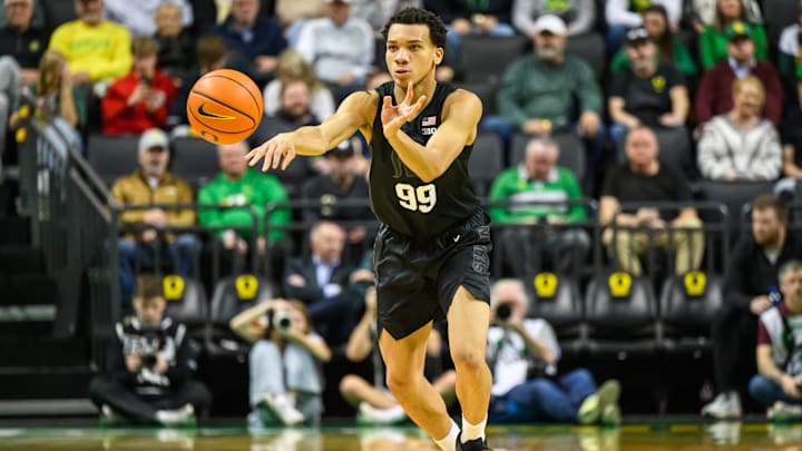 Jan 20, 2026; Eugene, Oregon, USA; Michigan State Spartans guard Divine Ugochukwu (99) passes the ball during the second half against the Oregon Ducks at Matthew Knight Arena. Mandatory Credit: Craig Strobeck-Imagn Images