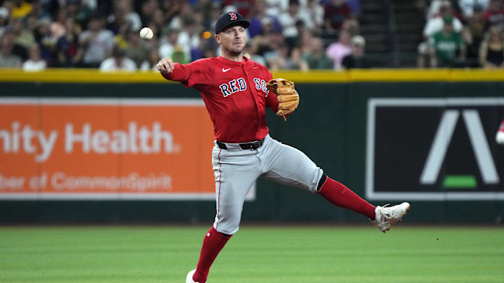 Sep 5, 2025; Phoenix, Arizona, USA; Boston Red Sox third base Alex Bregman (2) mkaes the off balance throw for an out against the Arizona Diamondbacks in the first inning at Chase Field. Mandatory Credit: Rick Scuteri-Imagn Images
