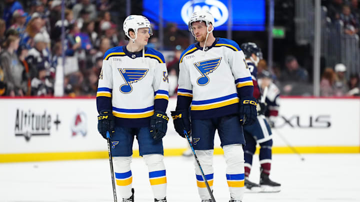 Mar 29, 2025; Denver, Colorado, USA; St. Louis Blues center Radek Faksa (12) and center Dalibor Dvorsky (54) before the game against the Colorado Avalanche at Ball Arena. Mandatory Credit: Ron Chenoy-Imagn Images