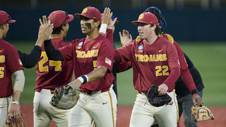 May 31, 2025; Corvallis, OR, USA; USC pitcher Caden Hunter (22) high-fives teammates after a game against Saint Mary's at the NCAA Corvallis Regional at Goss Stadium. Mandatory Credit: Troy Wayrynen-Imagn Images